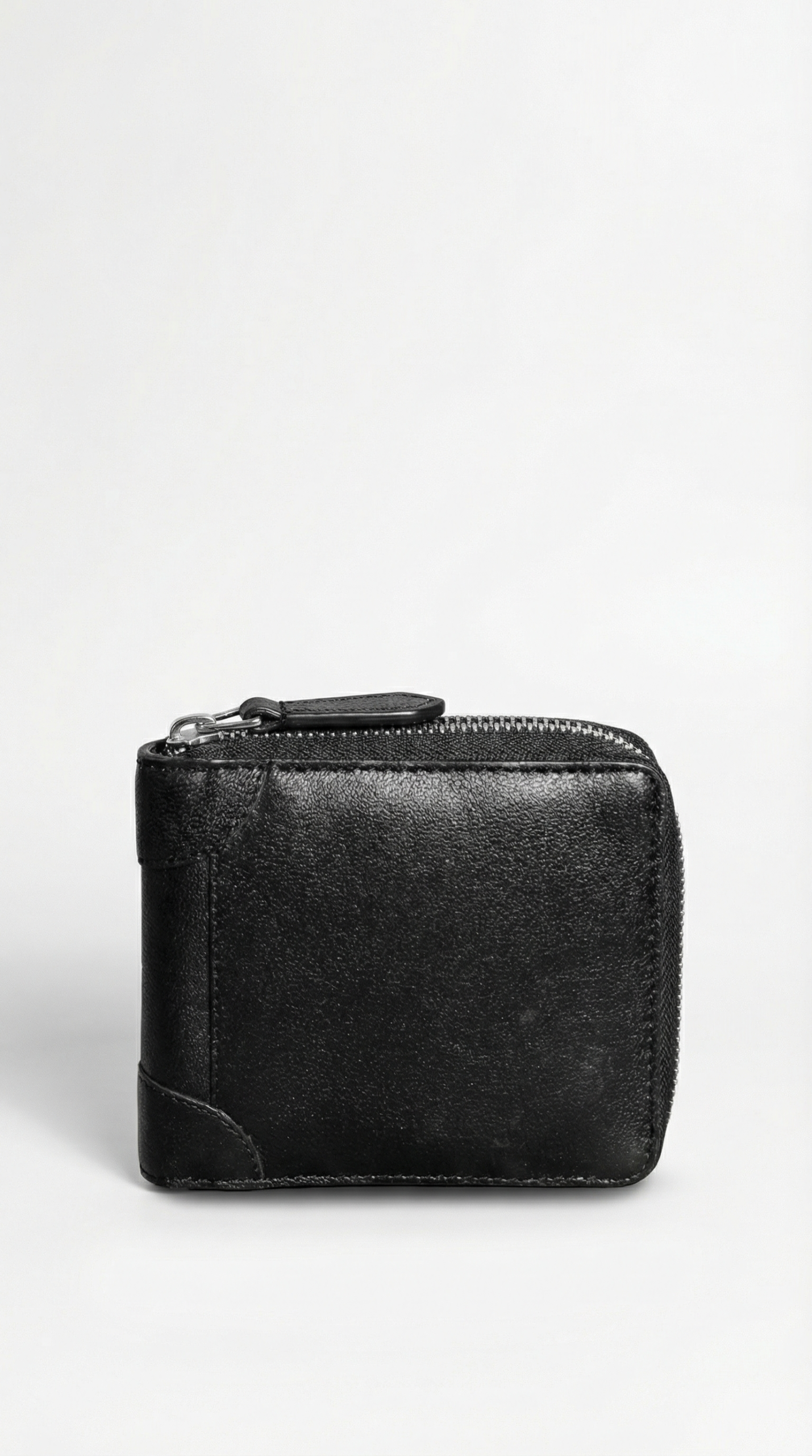 Black Genuine Leather Zip Wallet – Closed Exterior View Black genuine leather zip wallet closed exterior view with smooth finish and zipper closure